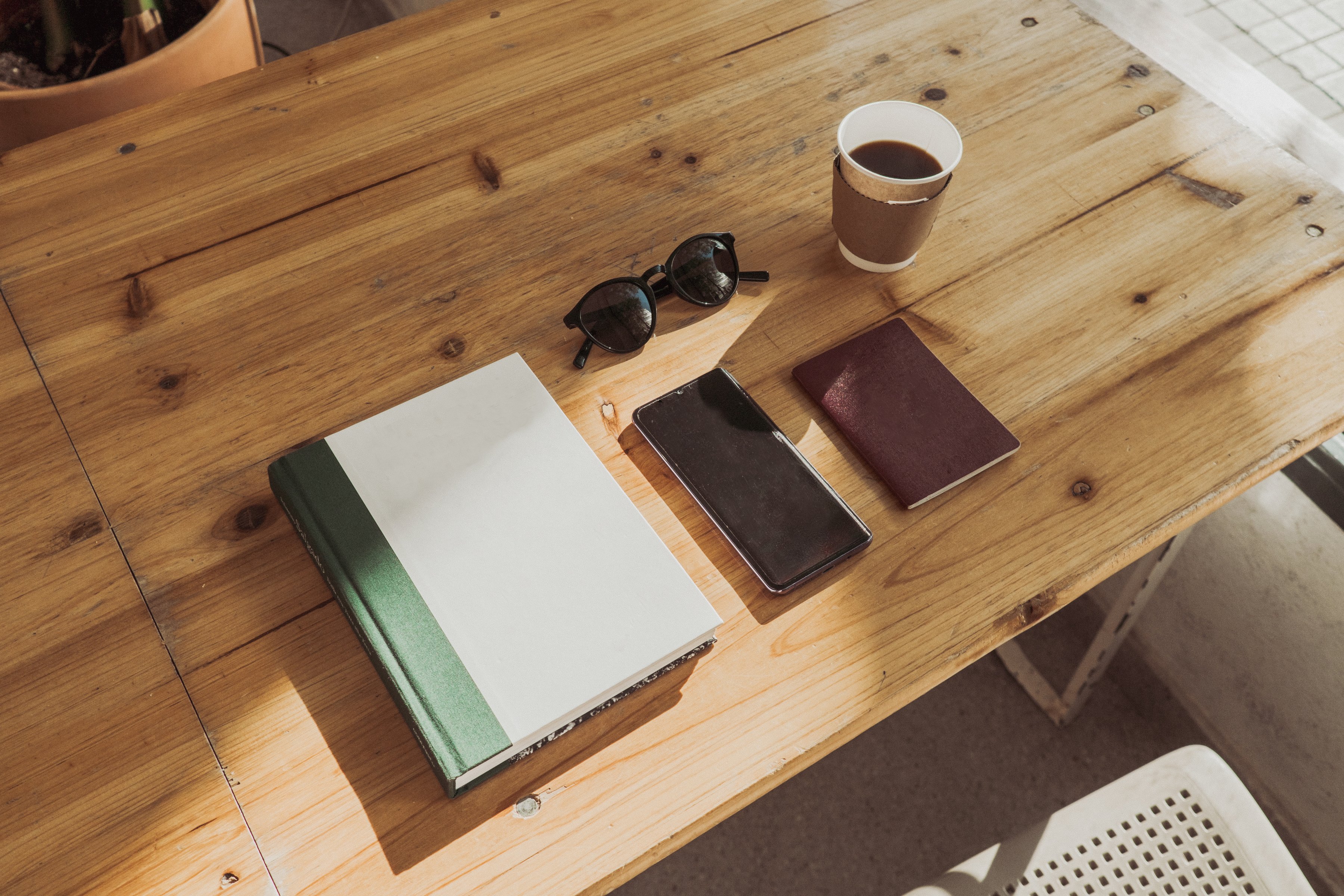 Planner, Smartphone, and Coffee on Table