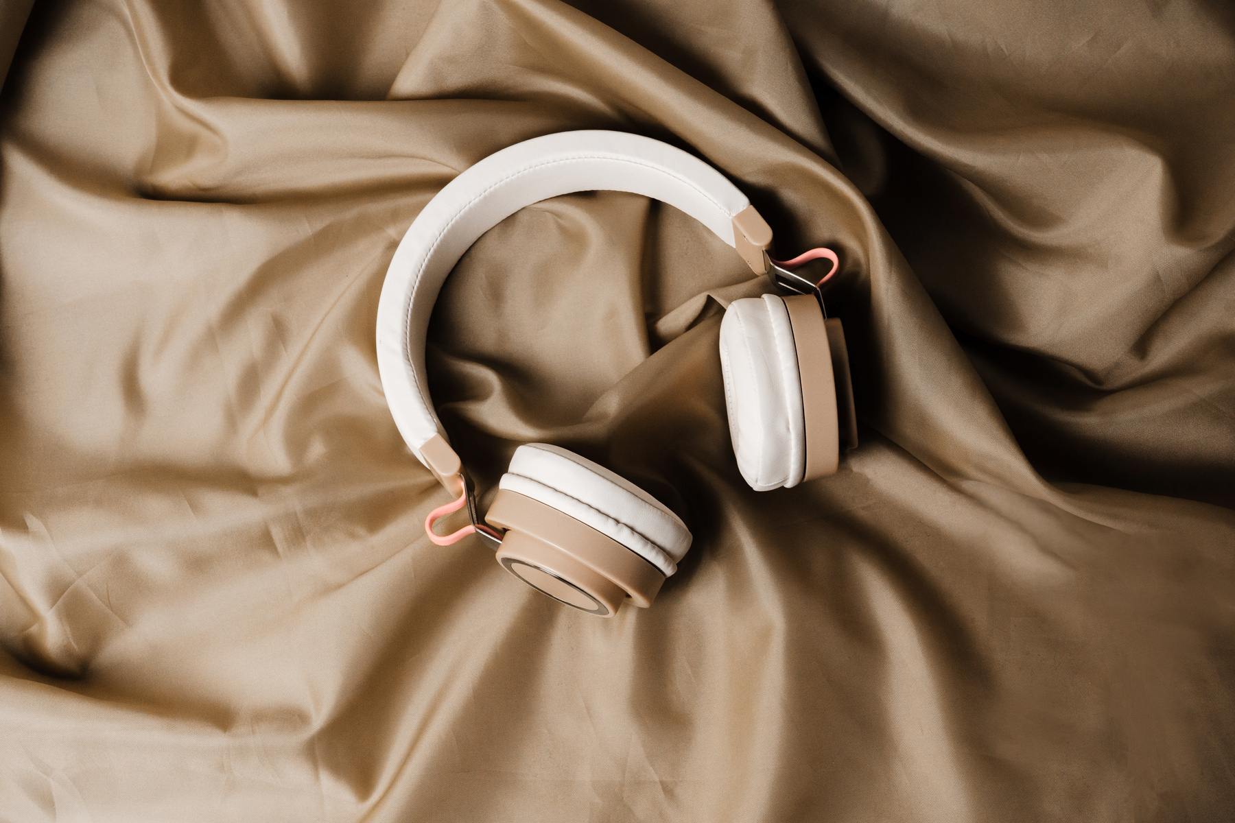 Wireless Headphones on Brown Silk Fabric